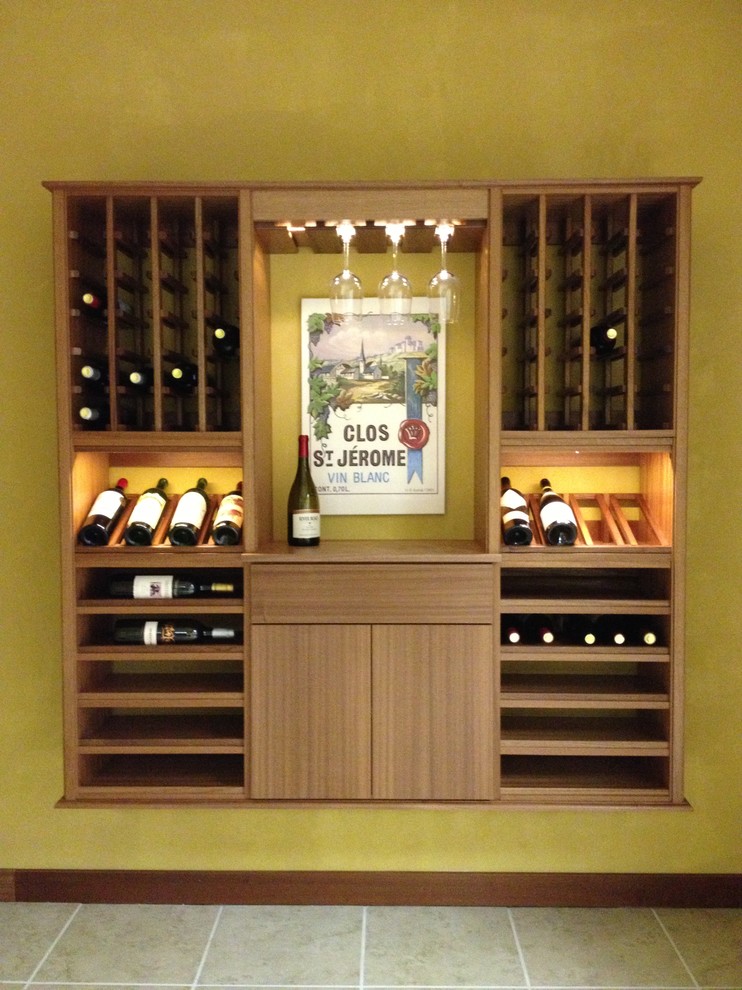 Small classic wine cellar in Charlotte with ceramic flooring and storage racks.
