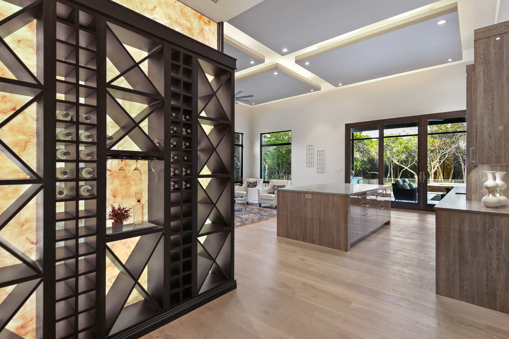 Example of a mid-sized transitional porcelain tile and brown floor wine cellar design in Austin with storage racks