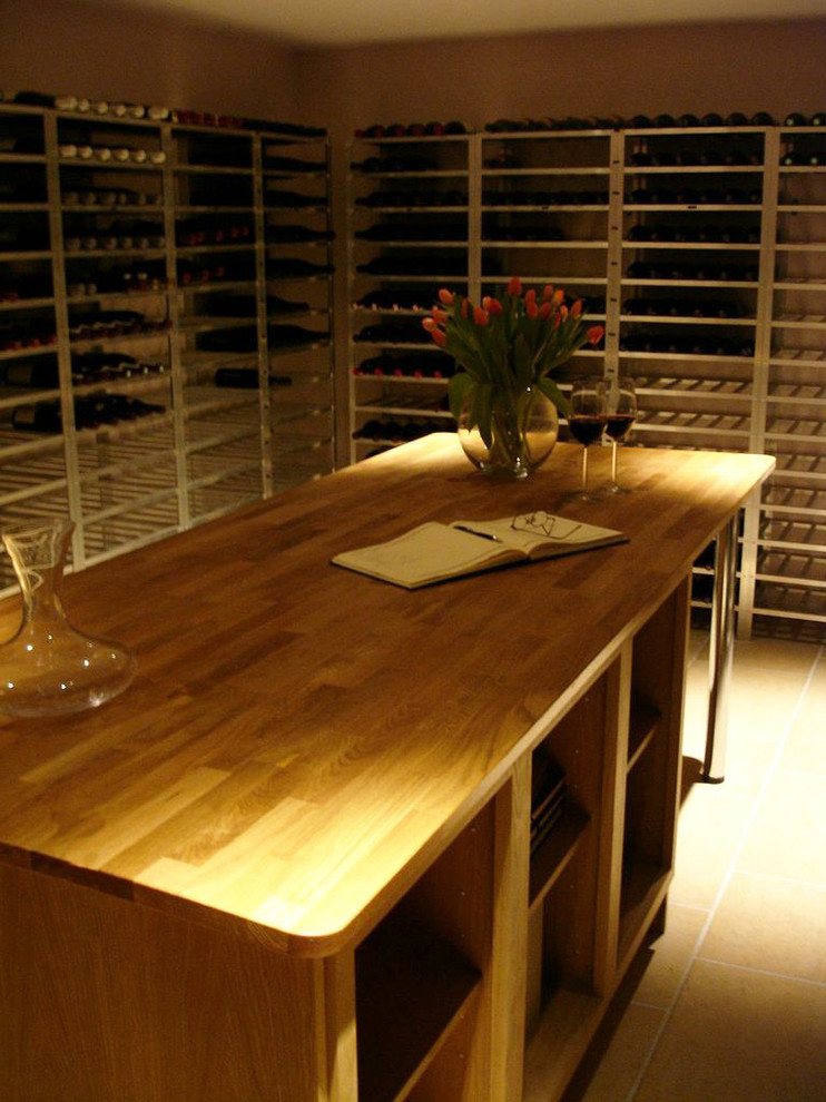 Design ideas for a contemporary wine cellar in Surrey.