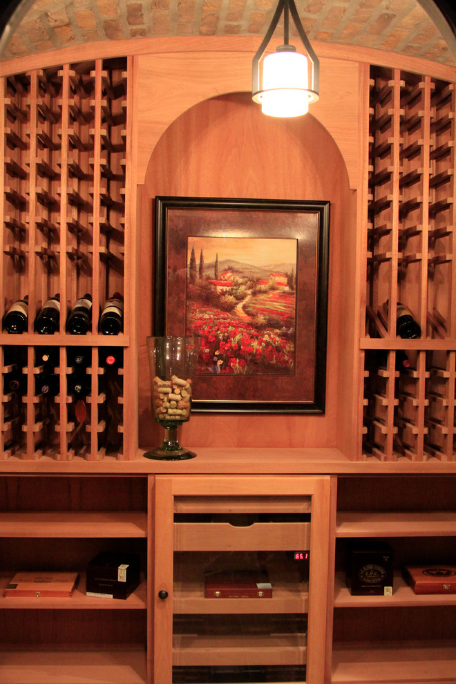 Wine cellar - mid-sized traditional wine cellar idea in Columbus with storage racks