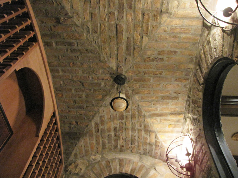 Photo of a medium sized traditional wine cellar in Columbus with storage racks.