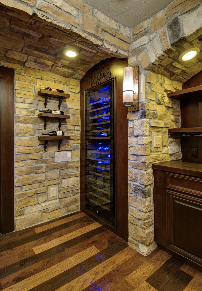 Design ideas for a medium sized traditional wine cellar in Denver with dark hardwood flooring, display racks and multi-coloured floors.