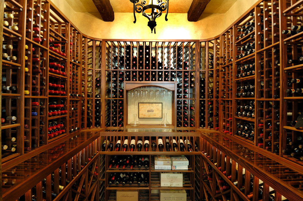 Example of a tuscan wine cellar design in Tampa