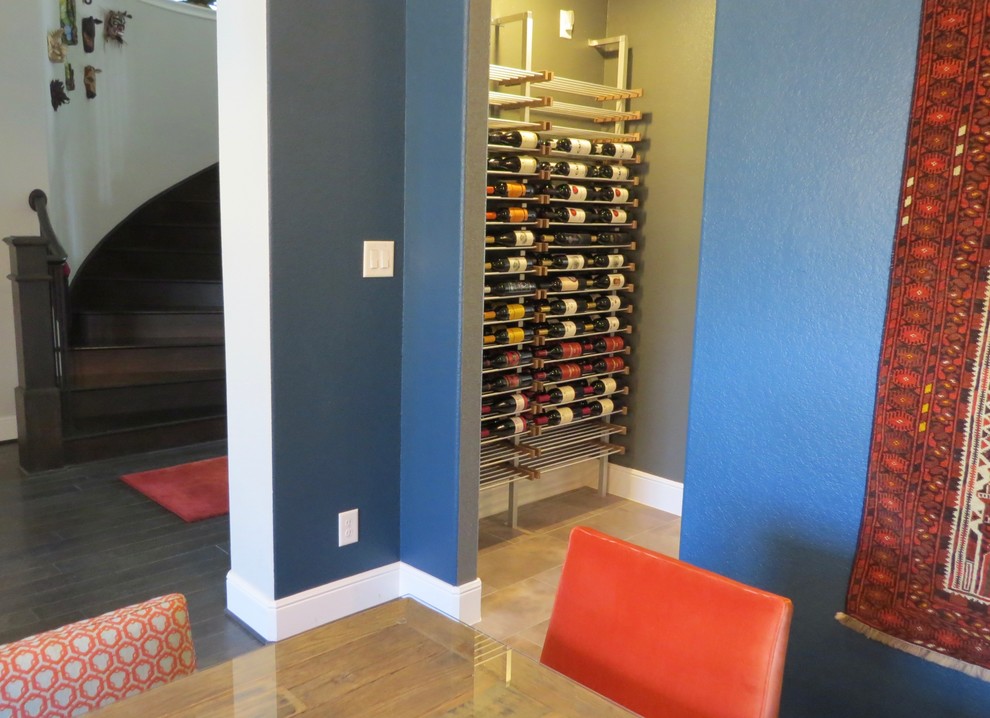 Photo of a small contemporary wine cellar in Houston with storage racks.