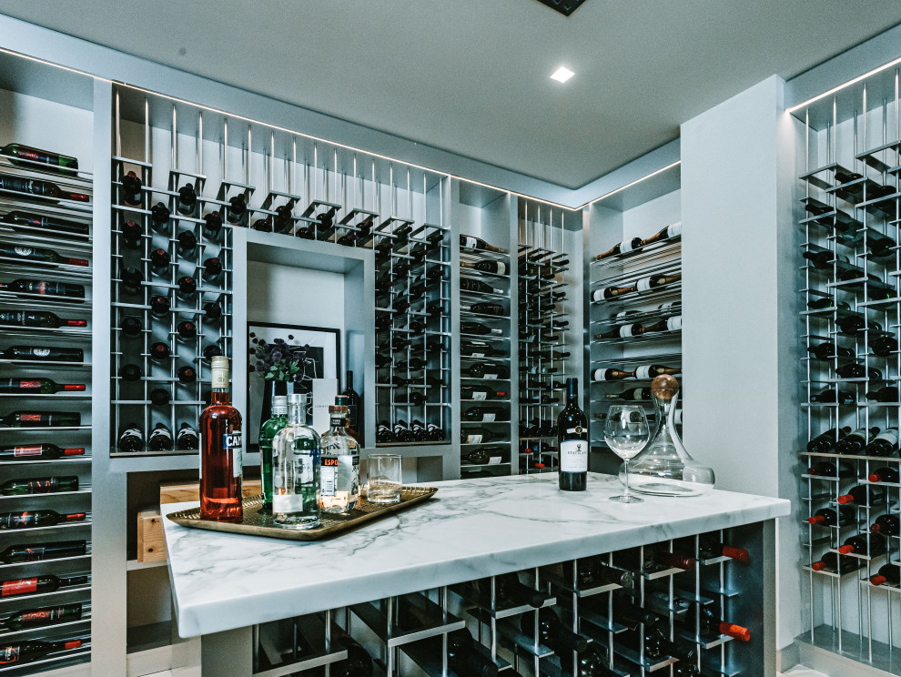 Photo of a large contemporary wine cellar in San Diego with storage racks.