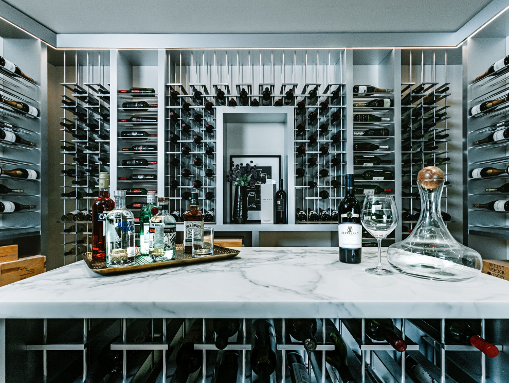 Photo of a large contemporary wine cellar in San Diego with storage racks.