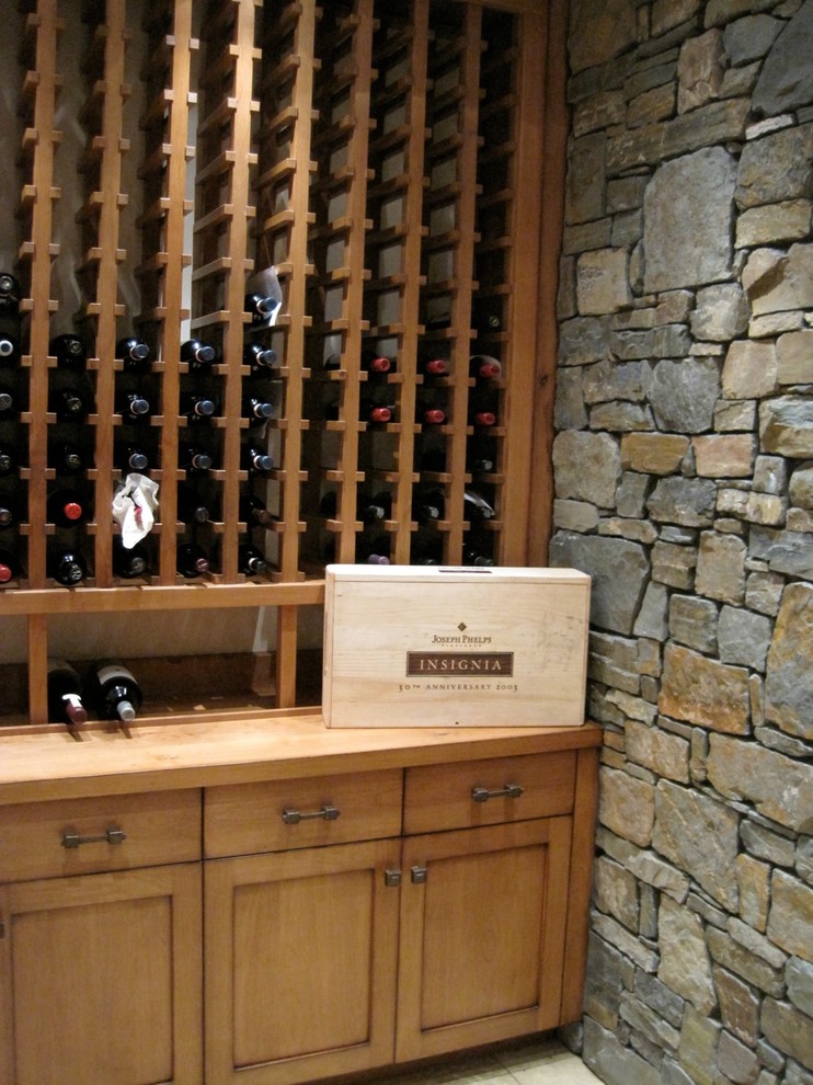 Mid-sized arts and crafts wine cellar photo in Seattle with display racks