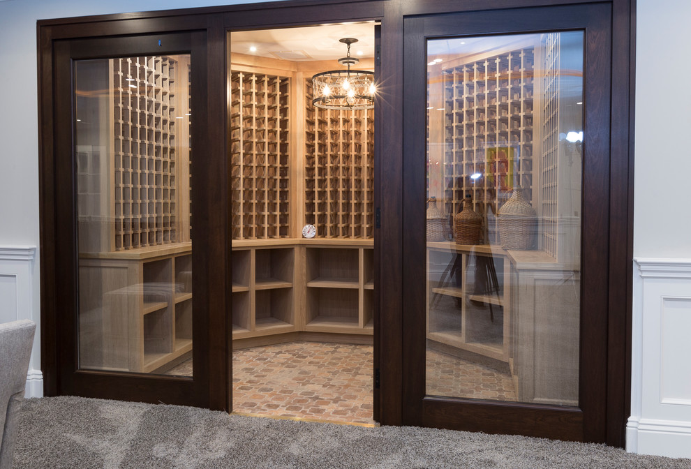 Inspiration for a large contemporary ceramic tile and brown floor wine cellar remodel in New York with storage racks