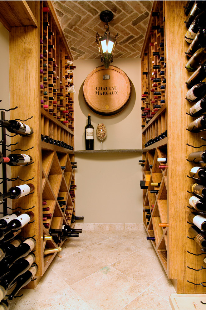 Photo of a medium sized classic wine cellar in Houston with travertine flooring.