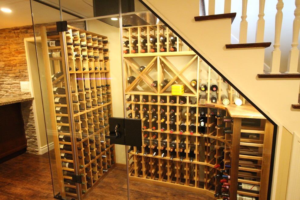 Temperature controlled wine cellar underneath the staircase Rustic