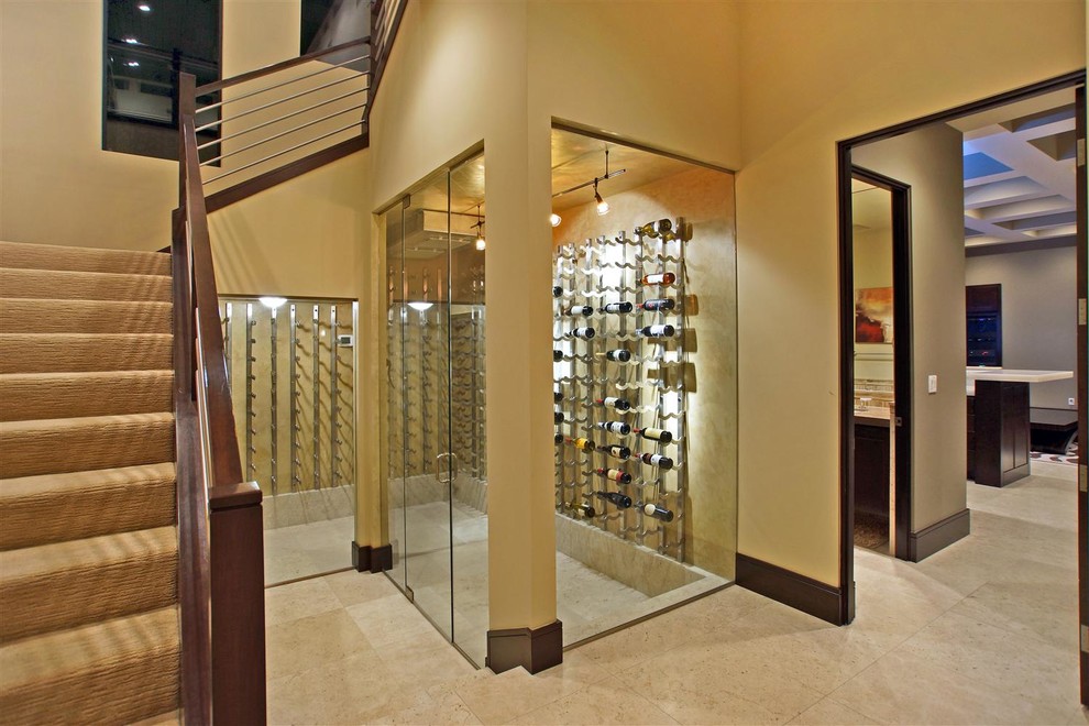 Wine cellar - contemporary beige floor wine cellar idea in Las Vegas