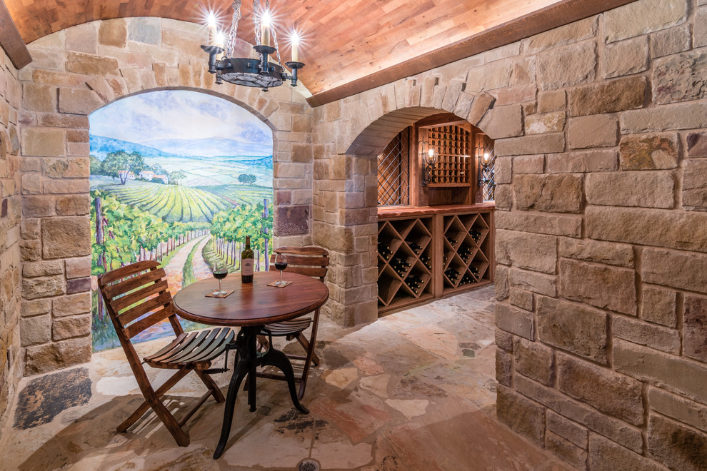 Wine cellar - mid-sized mediterranean limestone floor wine cellar idea in Austin with diamond bins