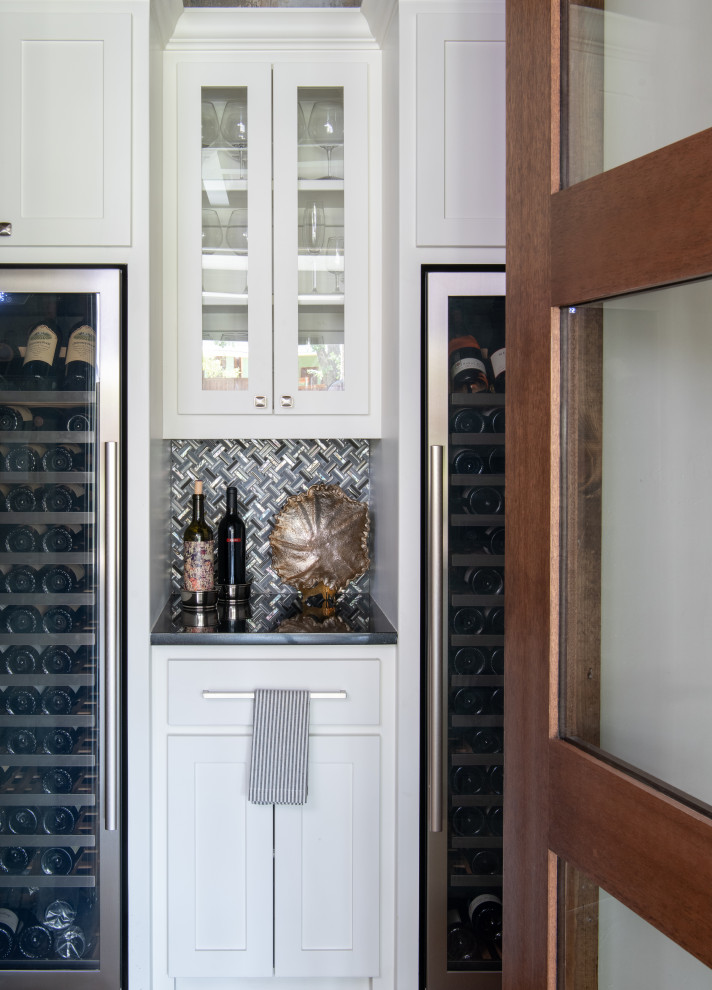 This is an example of a medium sized classic wine cellar in Dallas with storage racks.