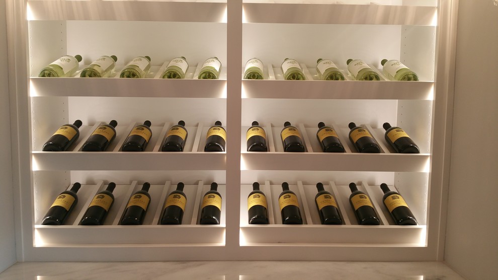 Photo of a medium sized classic wine cellar in Other with porcelain flooring and display racks.