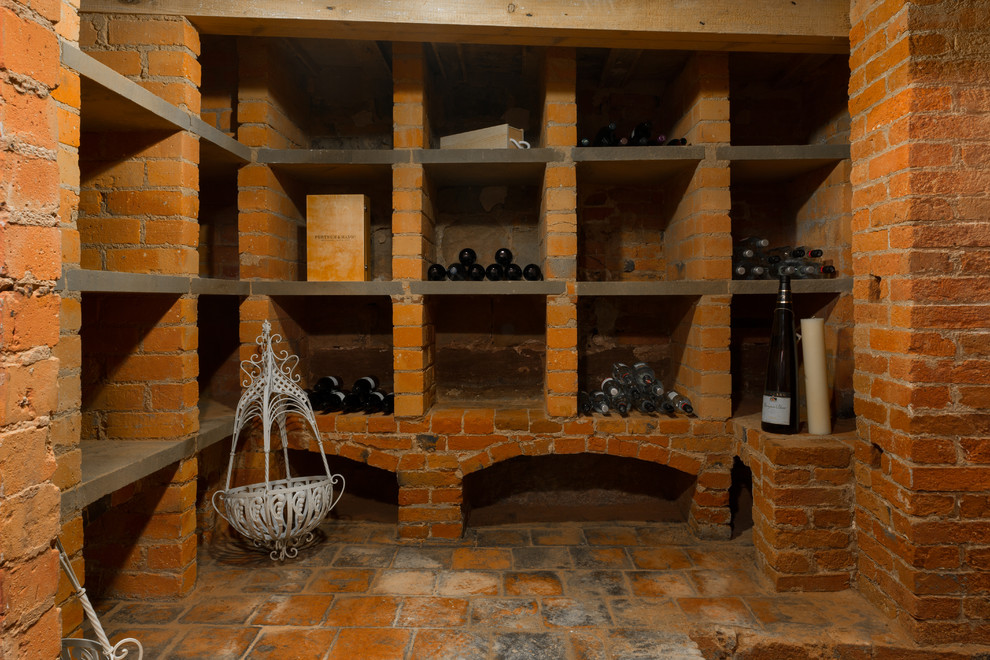 Example of a farmhouse wine cellar design in Surrey
