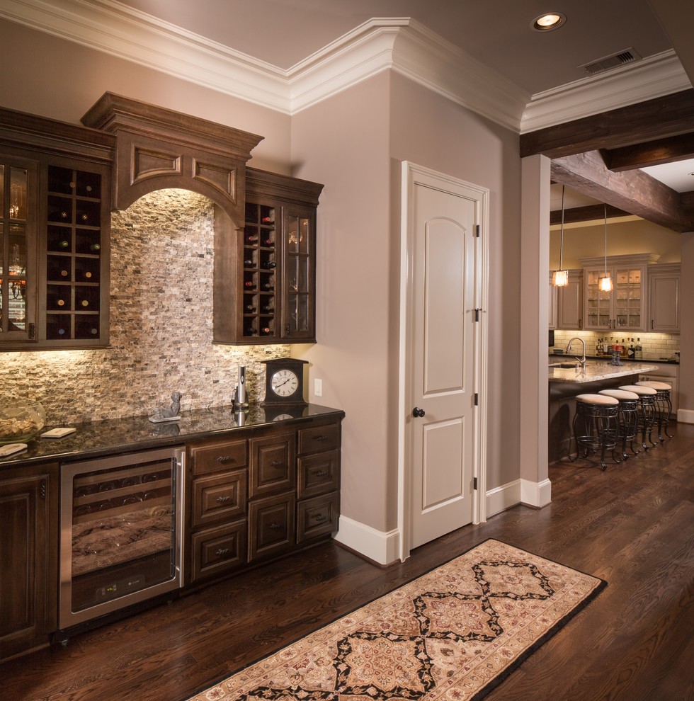 Inspiration for a mid-sized timeless dark wood floor wine cellar remodel in Houston