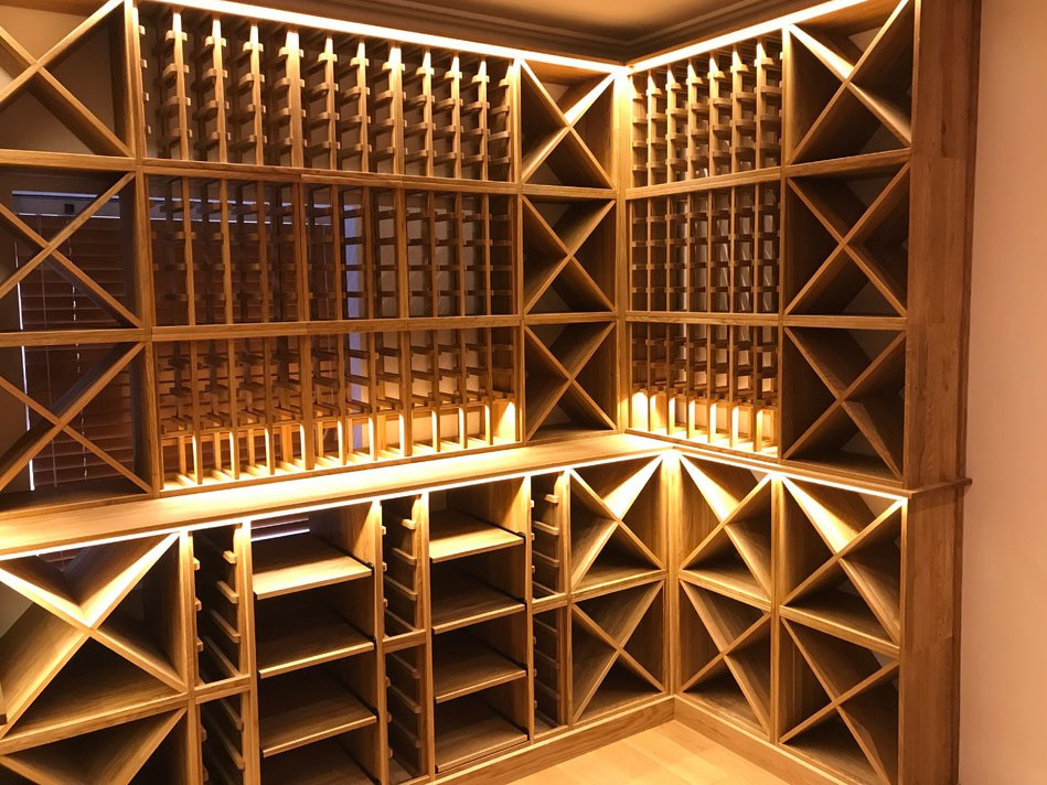 Three sided private wine room in Esher, Surrey using solid Oak racking