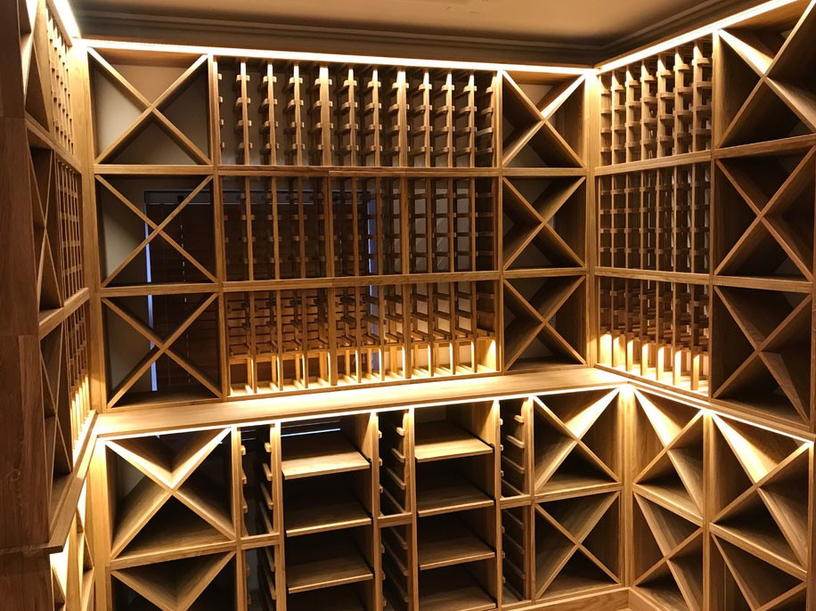 Large contemporary wine cellar in Surrey with storage racks.