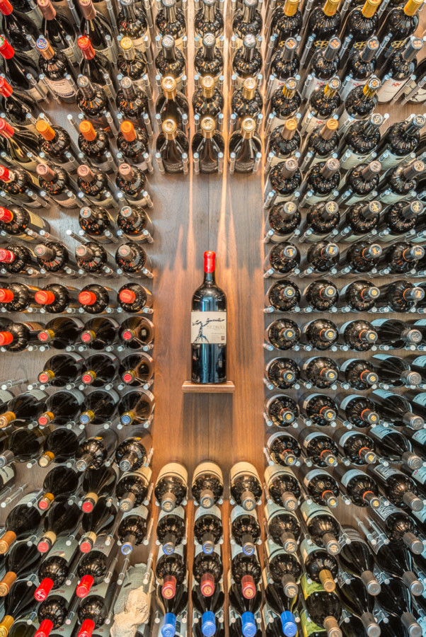 Photo of a modern wine cellar in San Francisco with storage racks.