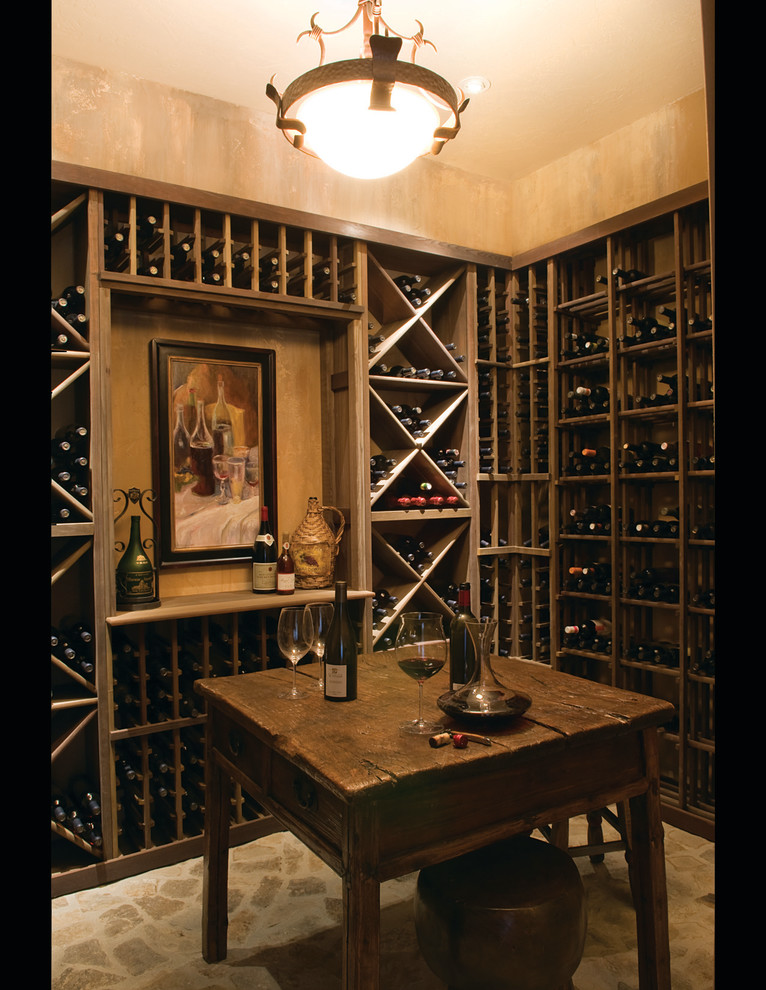 Design ideas for a medium sized traditional wine cellar in Denver with storage racks.