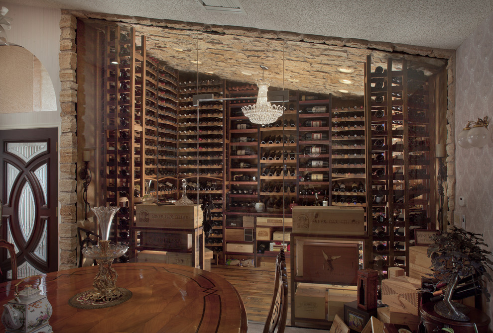 Wine cellar - large traditional medium tone wood floor wine cellar idea in Phoenix with storage racks