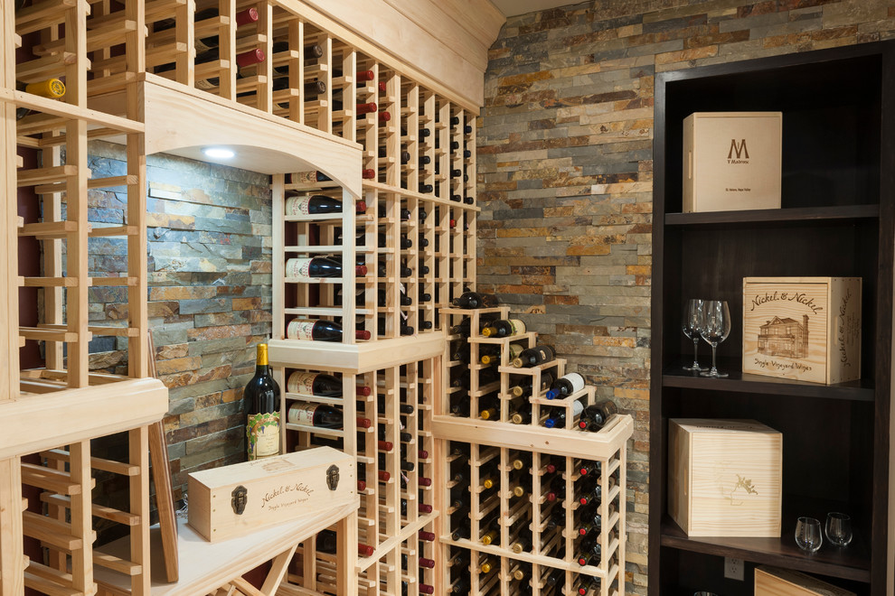 Traditional Wine Cellar with Stone Accent Wall and Wine Glass Storage