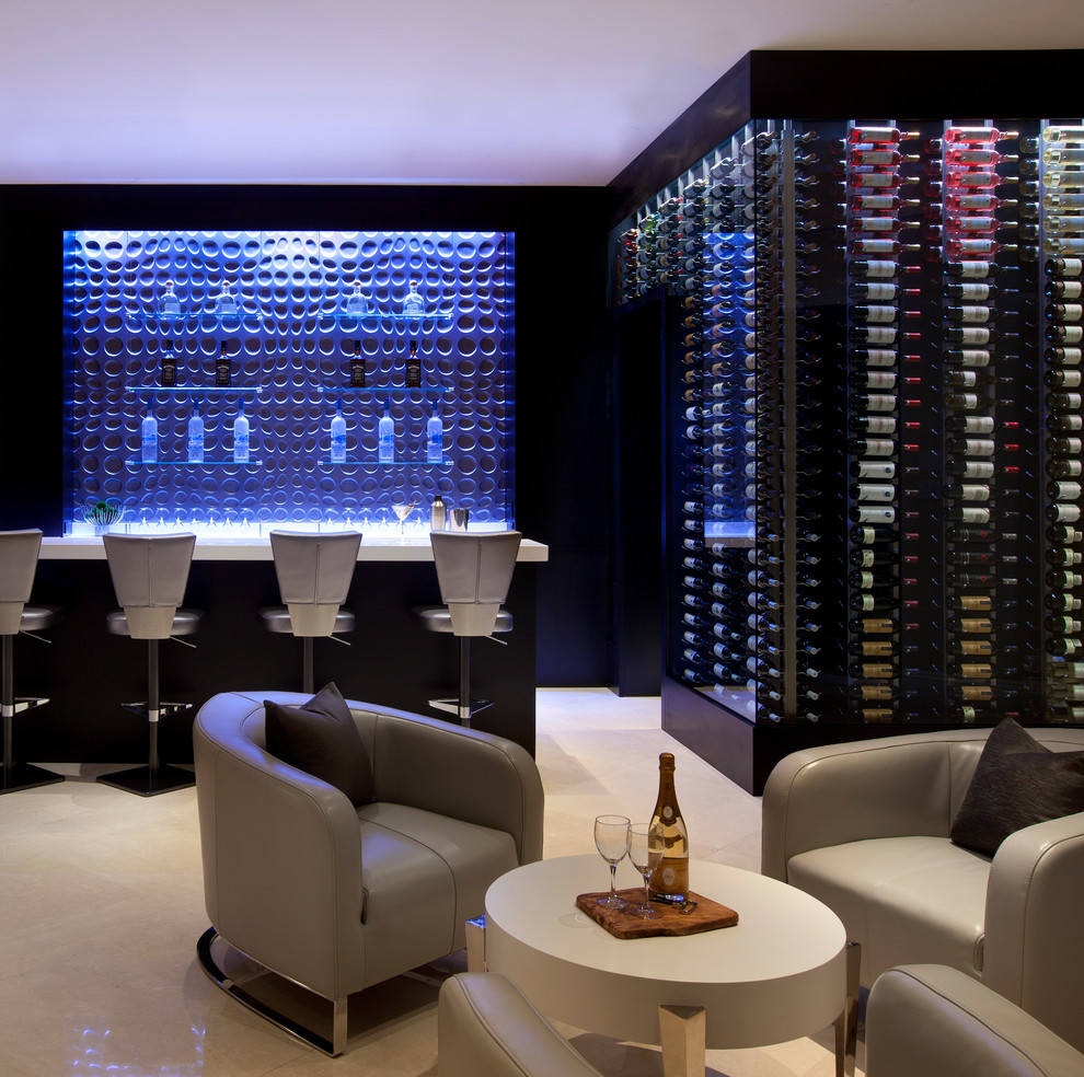 Expansive contemporary wine cellar in Phoenix with travertine flooring, cube storage and beige floors.