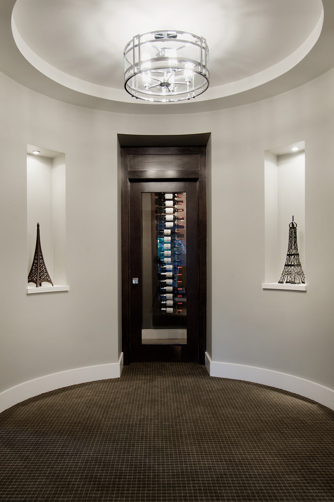 Design ideas for a traditional wine cellar in Calgary with carpet.