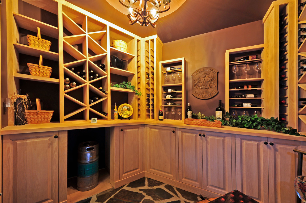 Mid-sized elegant slate floor and gray floor wine cellar photo in Other with storage racks