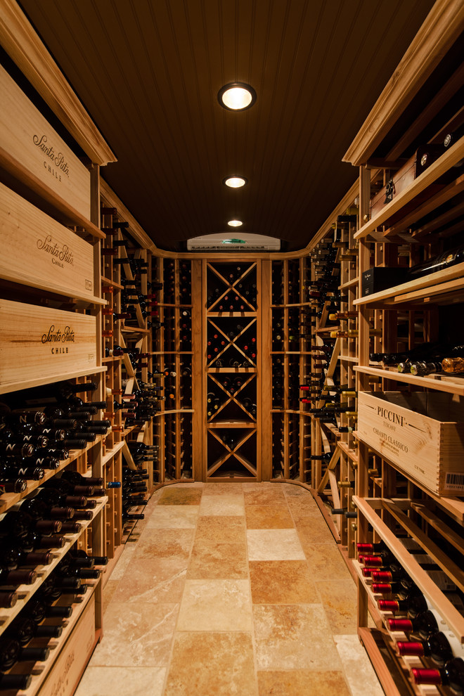 Inspiration for a traditional wine cellar in Richmond with storage racks and orange floors.
