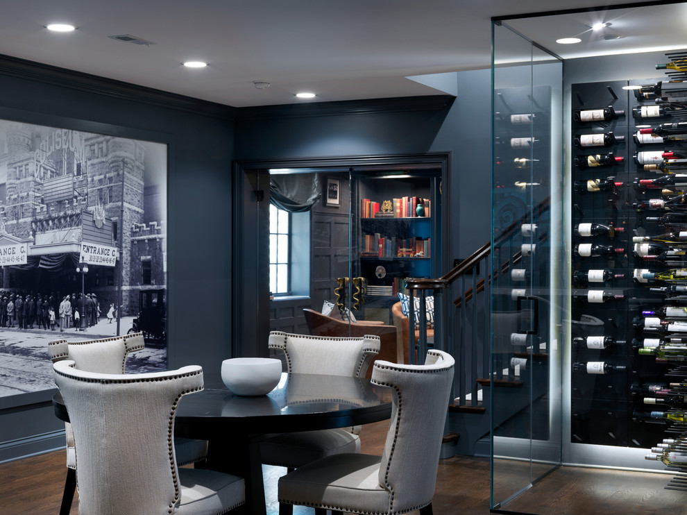 Design ideas for a medium sized traditional wine cellar in Chicago with dark hardwood flooring, display racks and brown floors.
