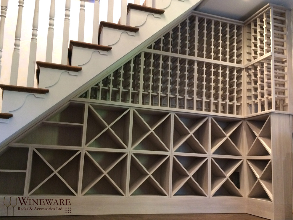 Contemporary wine cellar in Other with storage racks.