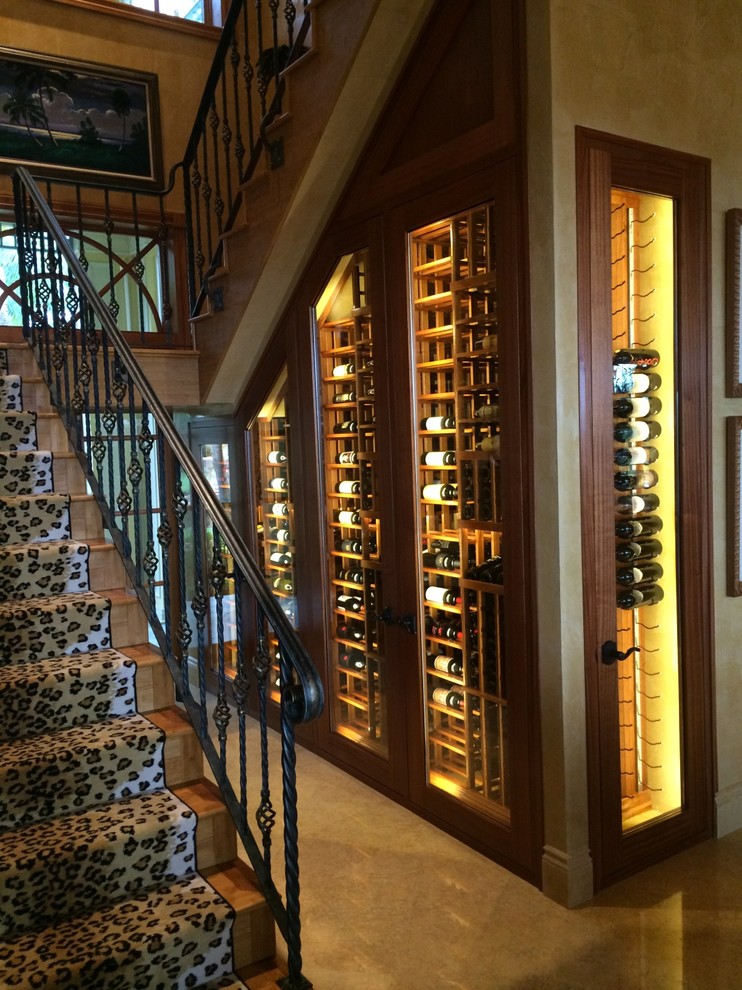 This is an example of a medium sized traditional wine cellar in Miami with storage racks.