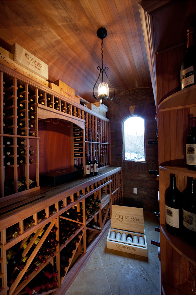 This is an example of a classic wine cellar in Charlotte with storage racks.
