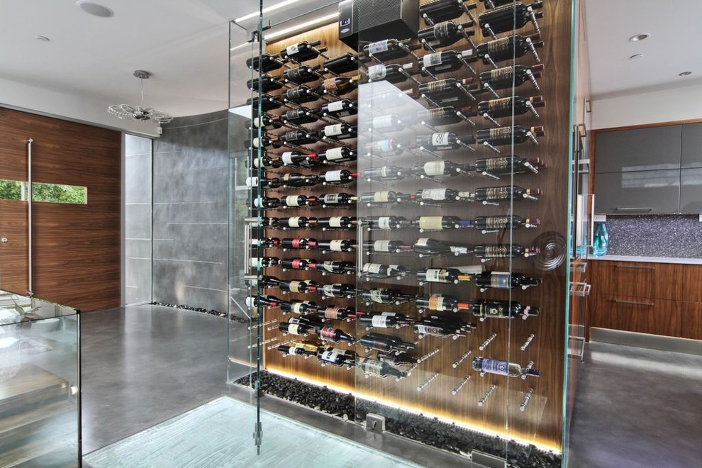 This is an example of a small modern wine cellar in Vancouver.