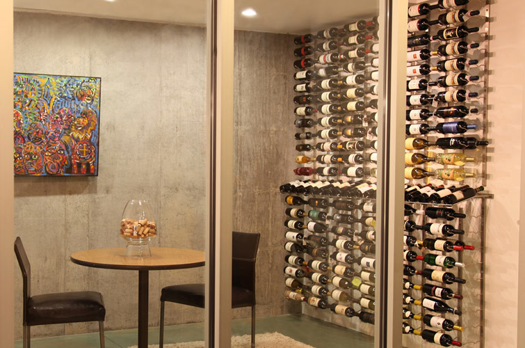 Inspiration for a small contemporary wine cellar in Orange County with display racks.