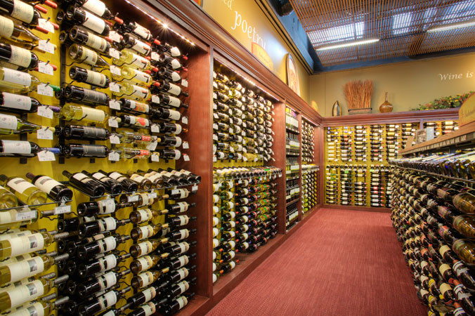 Wine cellar - contemporary wine cellar idea in Orange County with display racks