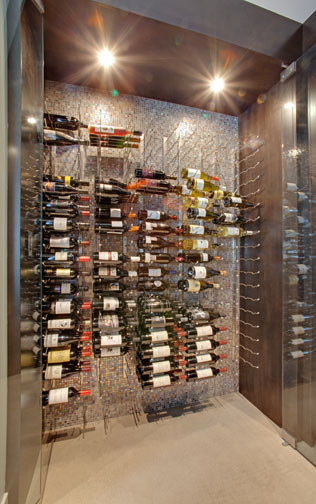 Wine cellar - small modern porcelain tile wine cellar idea in Vancouver with storage racks