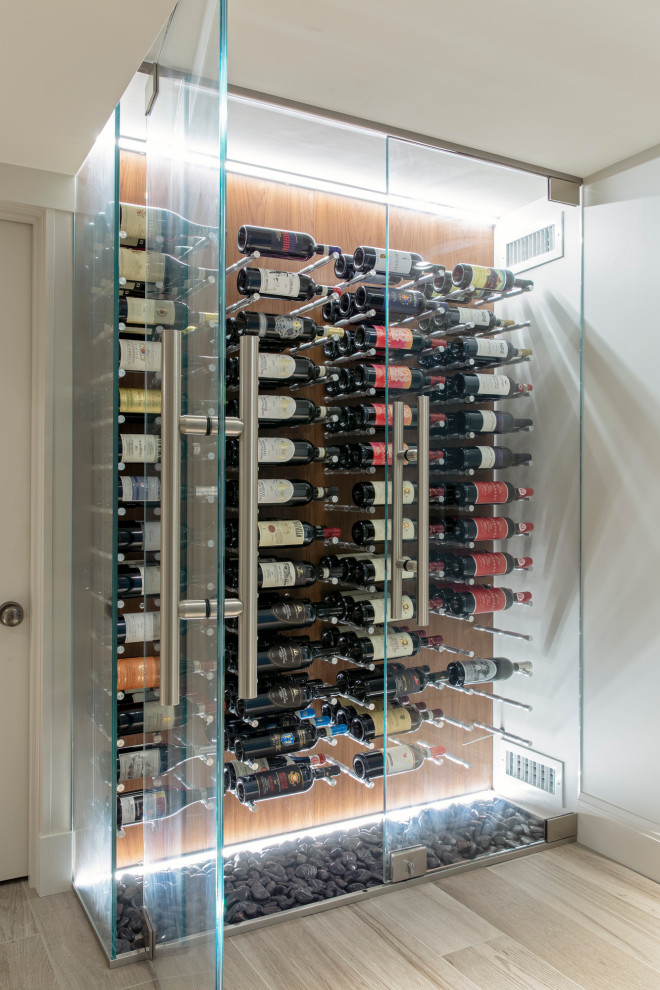 Inspiration for a small transitional gray floor wine cellar remodel in Boston with storage racks