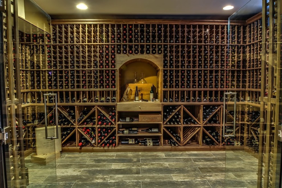 Inspiration for a large timeless porcelain tile wine cellar remodel in DC Metro with storage racks