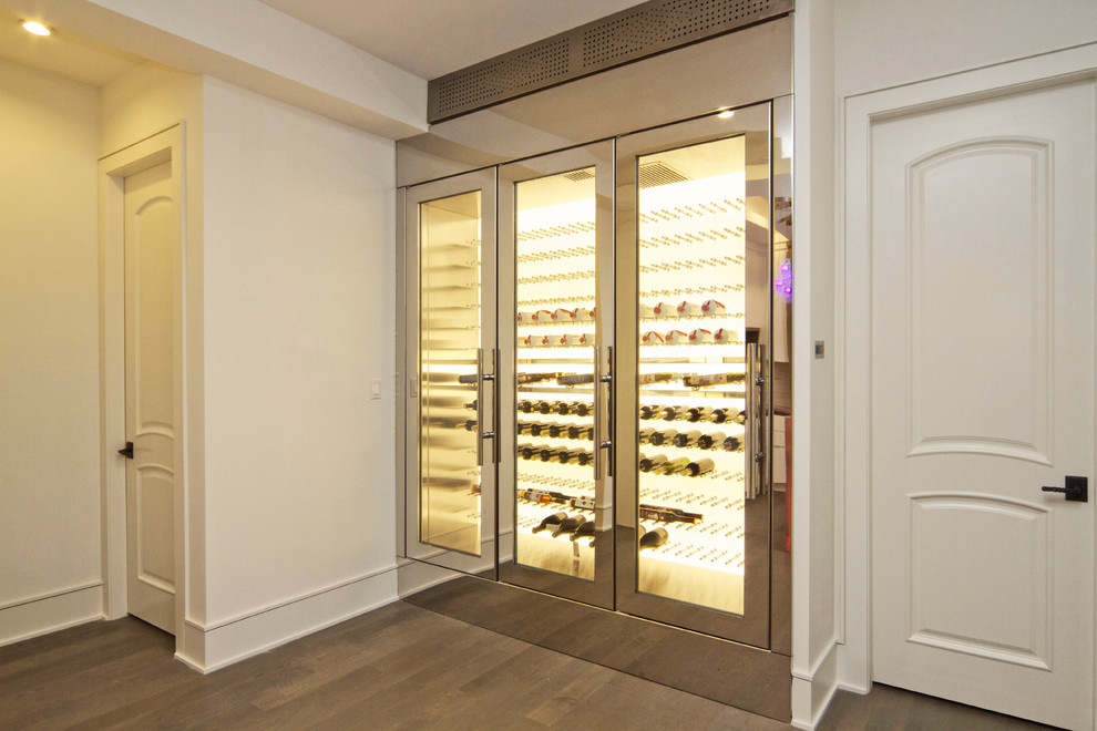 Photo of a medium sized modern wine cellar in Vancouver.