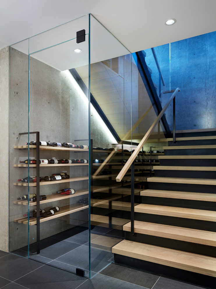 Medium sized contemporary wine cellar in Vancouver with grey floors.