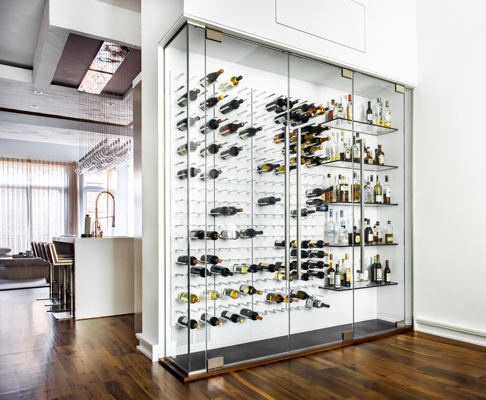 Large trendy medium tone wood floor and brown floor wine cellar photo in Chicago with display racks