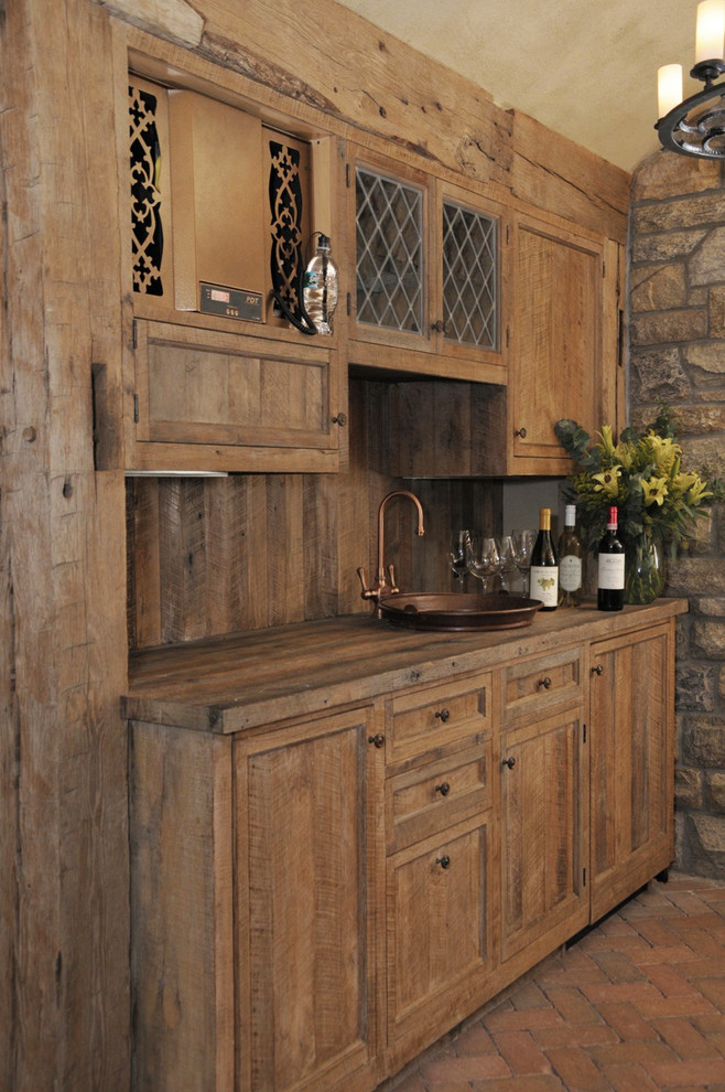Inspiration for a mid-sized rustic brick floor wine cellar remodel in New York with display racks