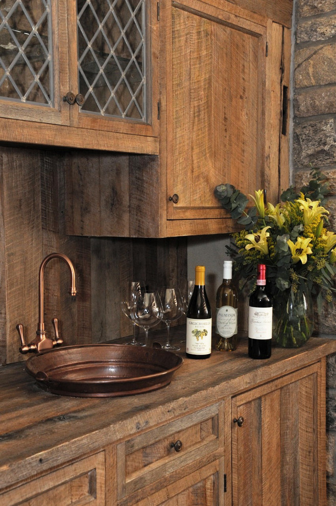 Inspiration for a mid-sized transitional brick floor wine cellar remodel in New York with display racks