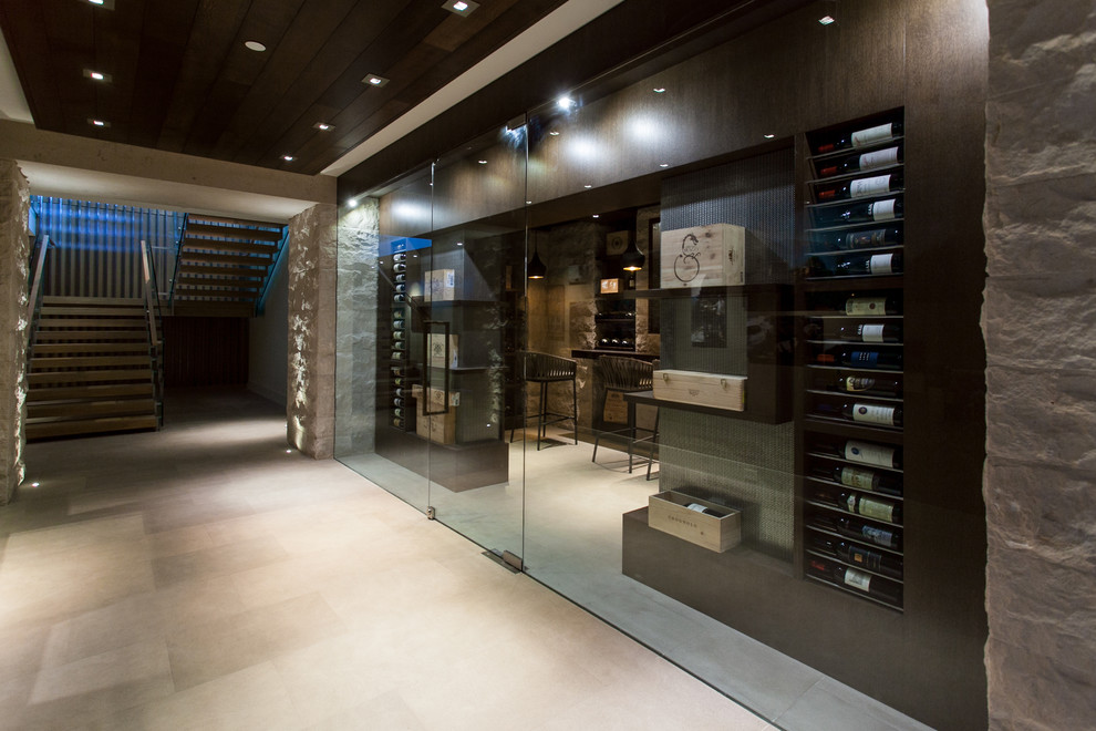 Photo of a medium sized contemporary wine cellar in Vancouver with marble flooring and display racks.