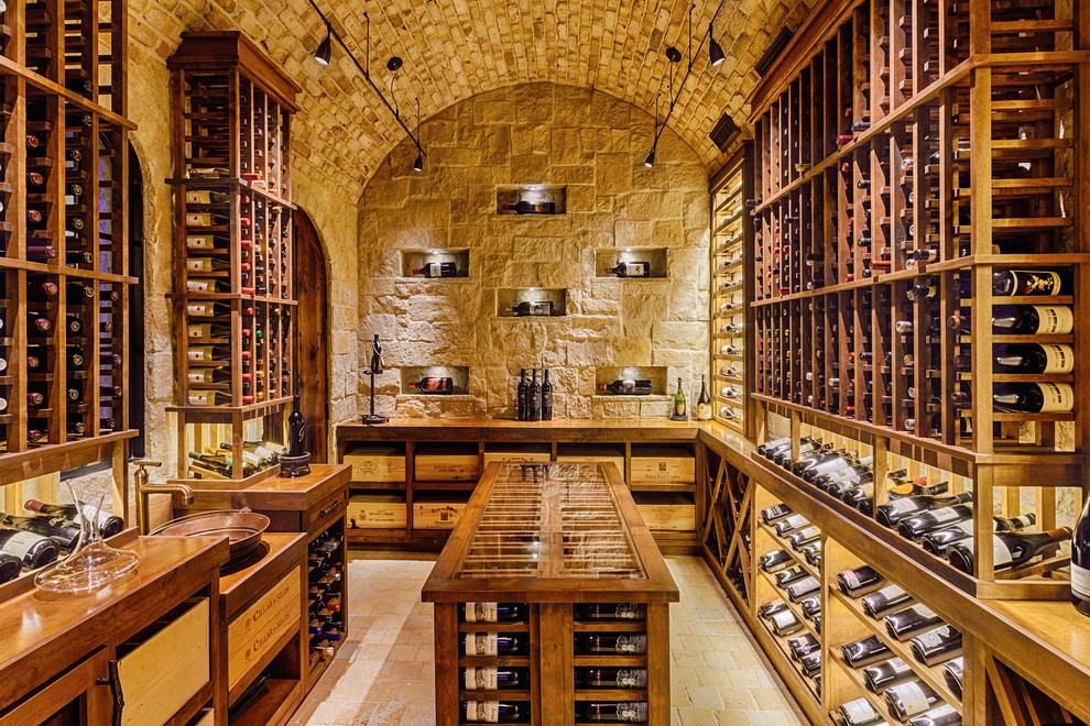 Inspiration for a mediterranean wine cellar remodel in San Diego with storage racks