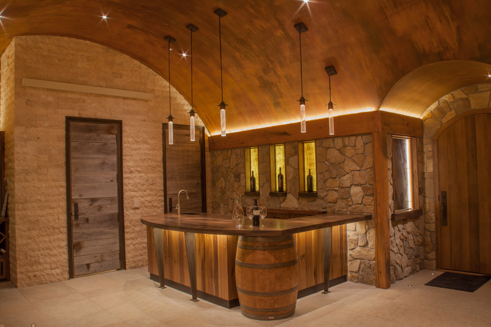 Inspiration for a mid-sized contemporary wine cellar remodel in Denver with display racks