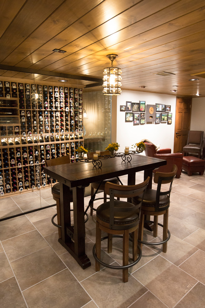 Large rustic wine cellar in Chicago with porcelain flooring and storage racks.