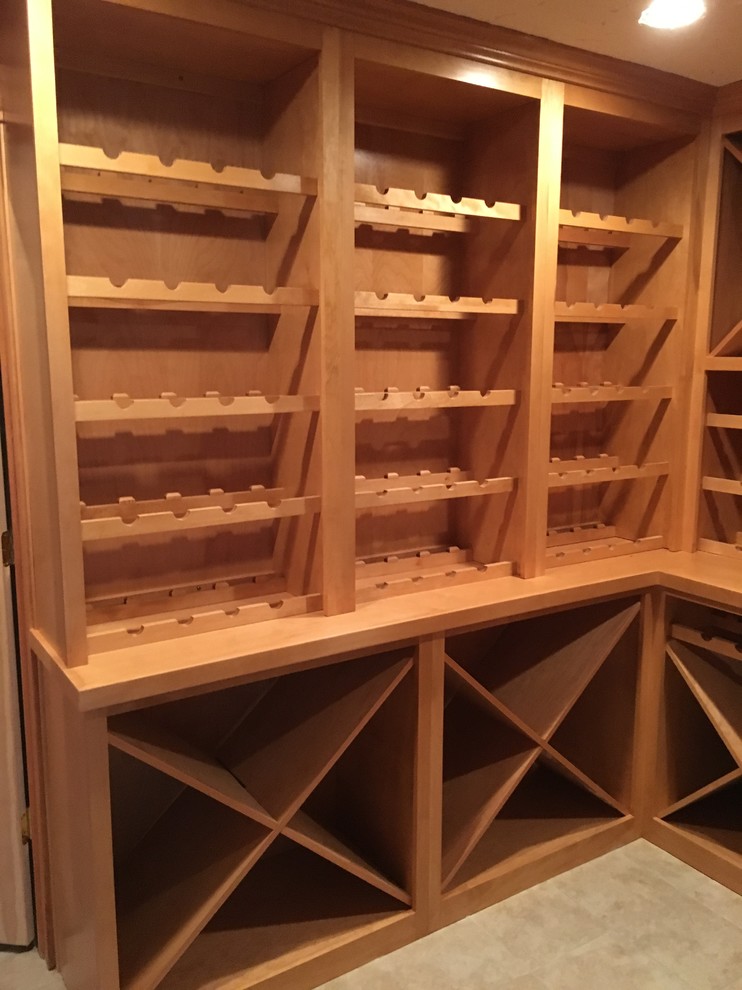 Medium sized traditional wine cellar in Chicago with porcelain flooring and cube storage.